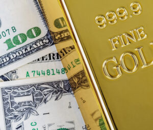Gold bullion on the background of dollar bills